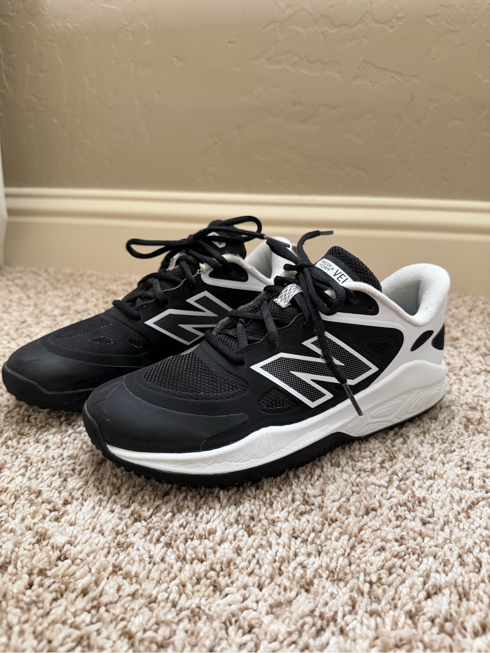 New Balance Men’s/Big Kids Black and White Athletic turf Sneakers